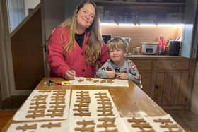 Laura Sharpe and son George are pictured with some of their 500 gingerbread men