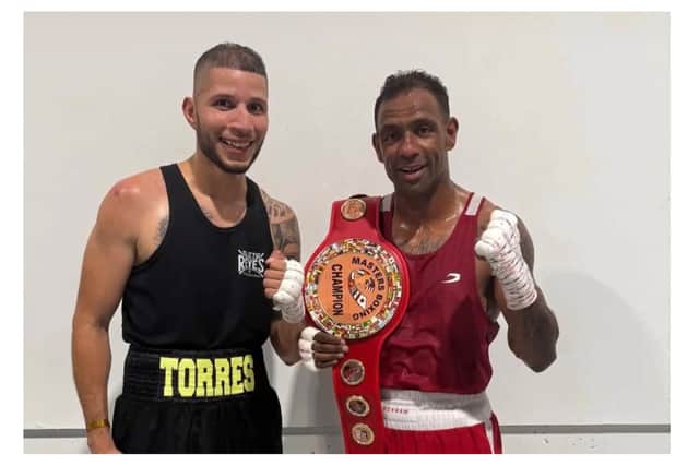 Banbury boxer Marlon “Mr Magic” Gray-Deacon (L) alongside opponent Giovanni Torres after making history as the first boxer to win all seven major Masters boxing tournaments in the USA.