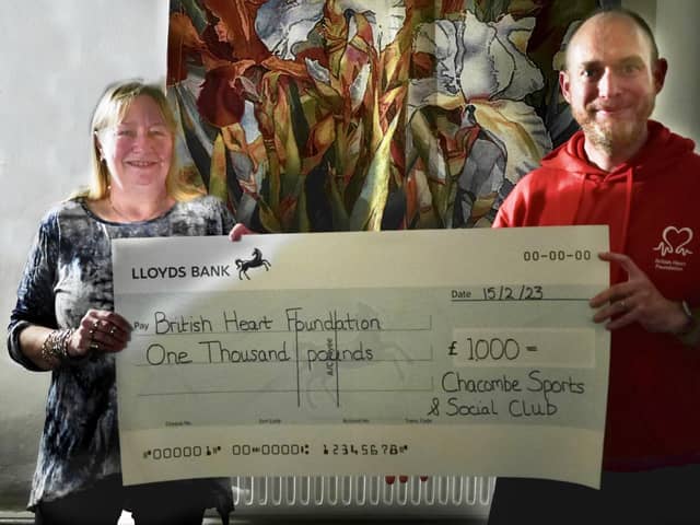 The Sports and Social Club's Lorna Fyfe presenting a cheque to Jon Frost from the British Health Foundation.