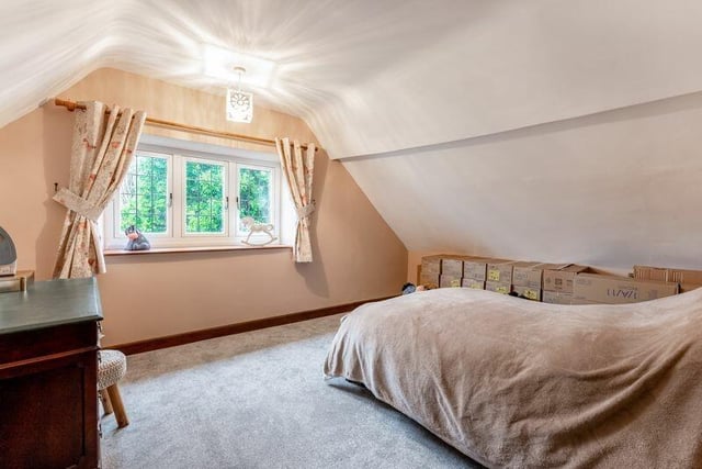 The house has three large bedrooms, all of which contain windows overlooking the garden.