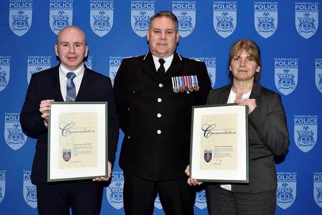Detective Sergeant Mark Personius (left) and Detective Constable Mandy Rhymes with their awards from Chief Constable John Campbell