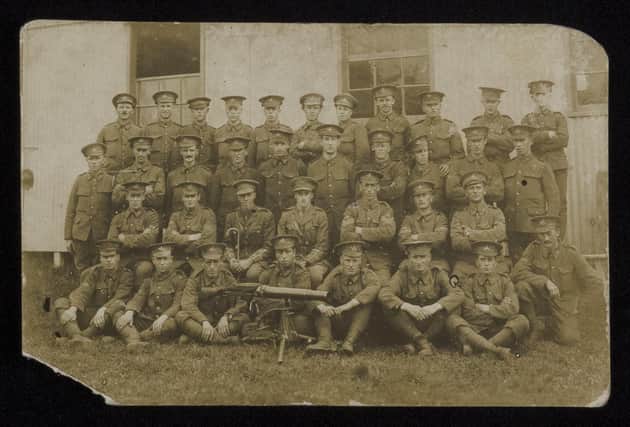 A group photograph taken when building POW Camp in Salonika with A Tolley, men with guns. 8th Bn Oxf and Bucks (SOFO Museum).