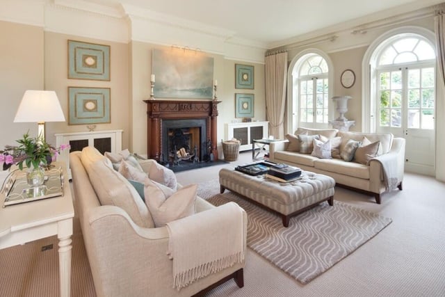 The living space with study, sitting room has two sets of French doors leading to the garden and the kitchen.