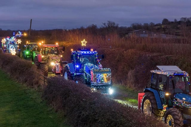 100 illuminated tractors snaked their way through the villages for the annual Christmas tractor run.