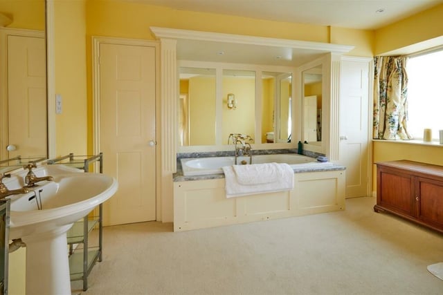 The master bedroom features a dressing room and bathroom.