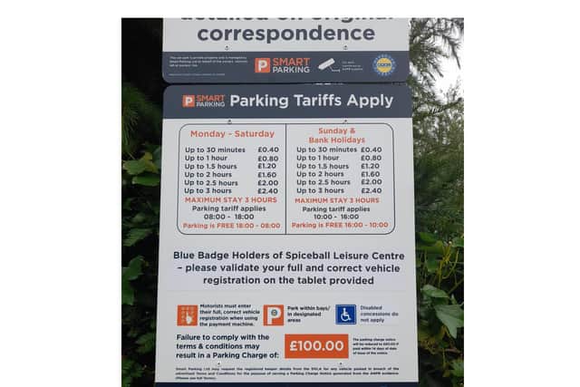 The current signs at the Spiceball Leisure Centre car park informing blue badge holders to enter their registrations into the tablet provided.