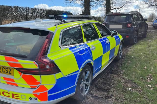 An uninsured driver got the shock of his life when he overtook a car on a blind summit - and nearly hit a police car on the other side.