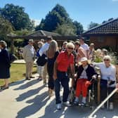 Residents, families, friends and members of the local community enjoying the Lake House garden.