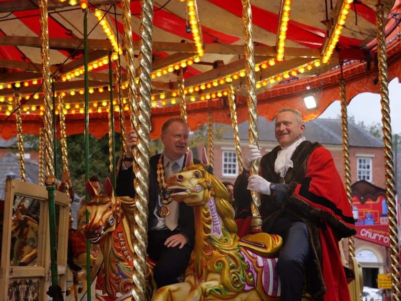 Mark Cherry and Cllr Nigel Simpson on the carousel ride.