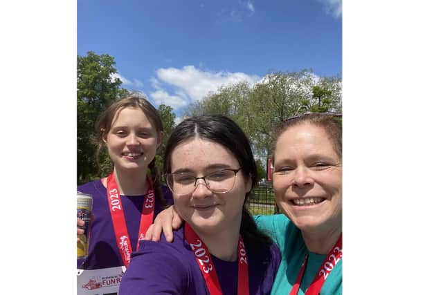 Paula alongside her daughter and niece after completing the Blenheim Palace fun run.