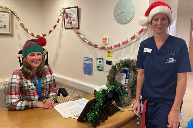 Receptionist Vicky Bennett and ward nurse Nicola Rossiter helping to make the hospice festive for patients this Christmas.
