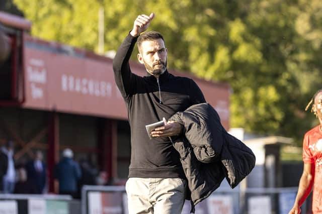 New manager Roger Johnson acknowledges the Brackley Town fans after a 1-1 draw with AFC Fylde in his first game in charge. Picture by Glenn Alcock