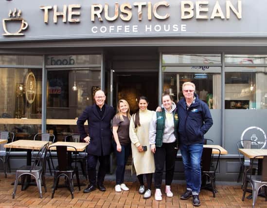 Members of the Banbury BID team and the Banbury Chamber of Commerce outside The Rustic Bean cafe.