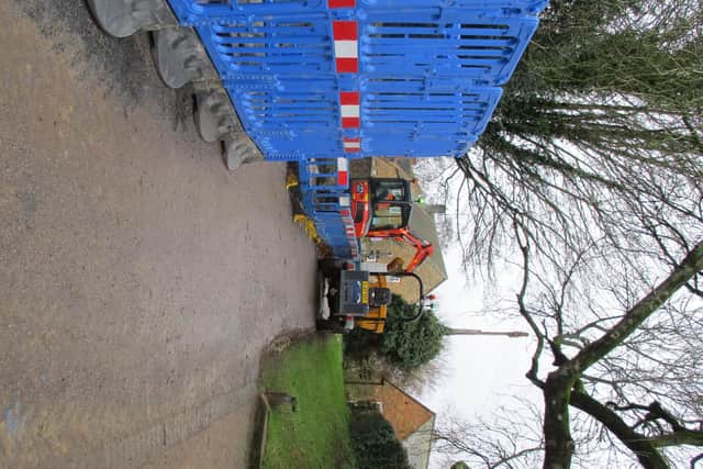 Thames Water contractors in place to do work beneath the new surface of Crow Lane