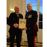 Hook Norton firefighter alongside Oxfordshire County Council’s Fire and Rescue Service’s Chief Fire Officer Rob MacDougall.
