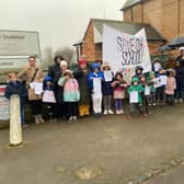 Parents and children gather outside Southfield School, Brackley to protest about closure plans on Sunday