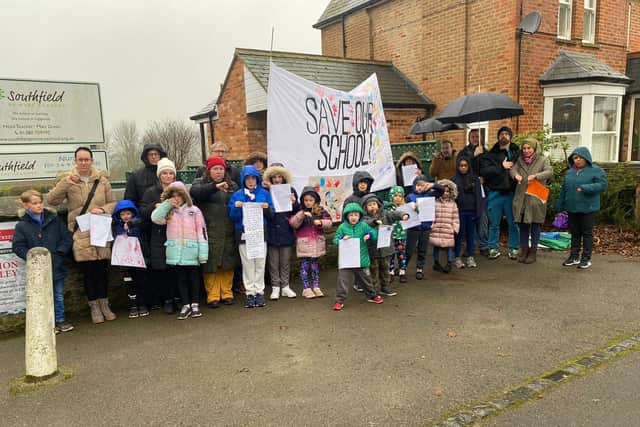 Parents and children gather outside Southfield School, Brackley to protest about closure plans on Sunday