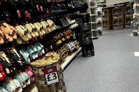 The clothing and shoes aisle at Banbury's B&M store.