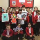 The pupils at St. Leonard's School displaying some of their fantastic artwork.