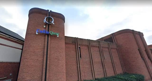 A councillor has received an apology from the council after a heated row over Banbury's Castle Quay shopping centre.