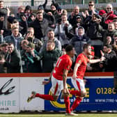 James Armson celebrates in front of the delighted Brackley Town fans after he scored from the penalty spot to seal a huge win over Gateshead at St James Park. Picture by Glenn Alcock
