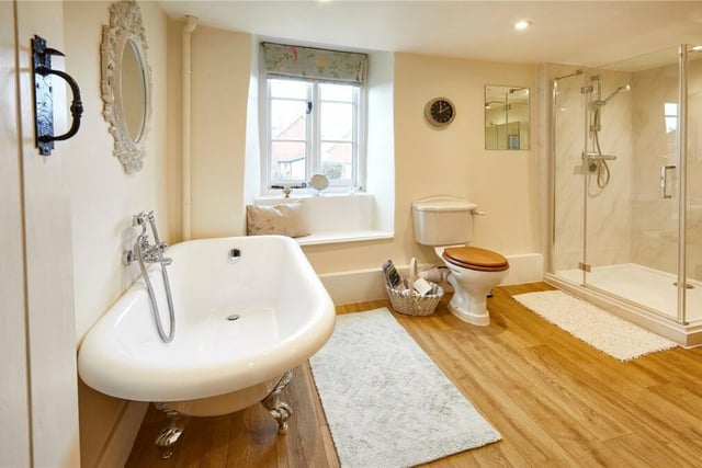 The bathroom has modern fixtures and fittings and a separate shower room.