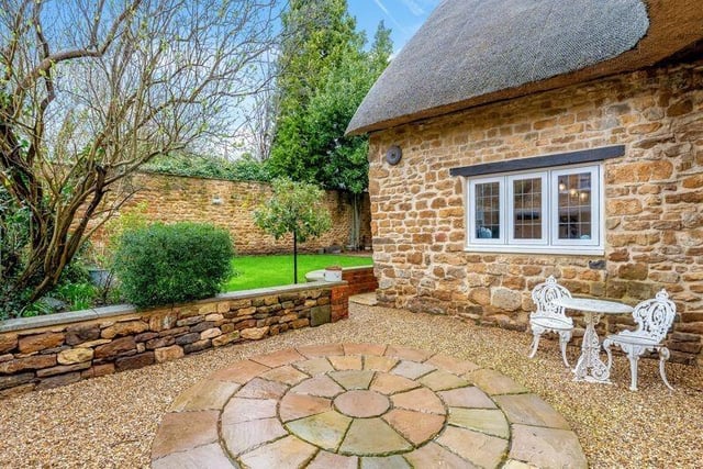 To the rear of the house there is a landscaped, walled garden which is laid to lawn with a paved and seating area.