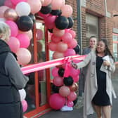 Danielle Buick cuts the ribbon at the grand opening of her new dance studio.