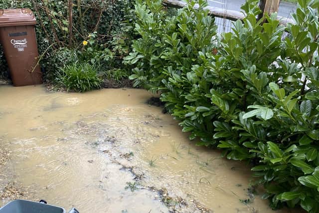 Water collects in the family's Clifton garden after heavy rain