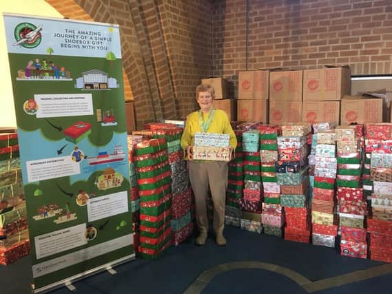 Eunice Harradine, organiser of Operation Christmas Child in Banbury, with some of last year's consignment of gift boxes
