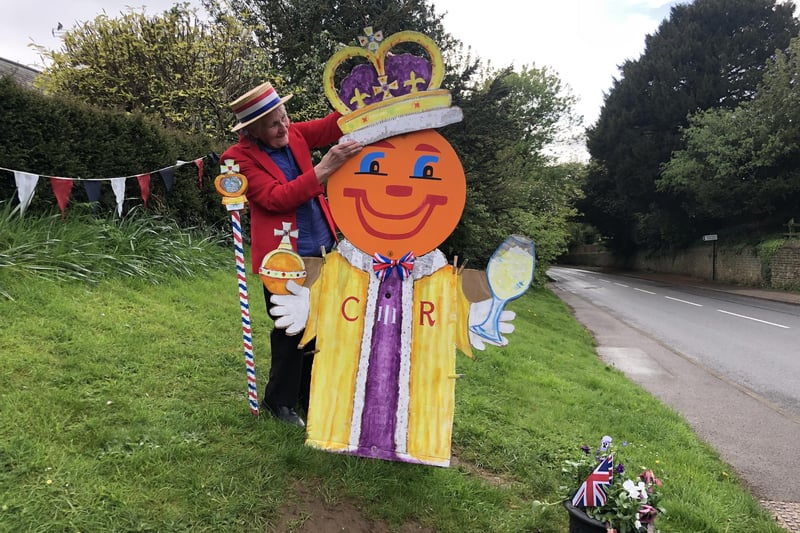 Chris Wells performs the crowning ceremony for Banksie, the Middleton Cheney roadside character who was given Royal garb for the Coronation
