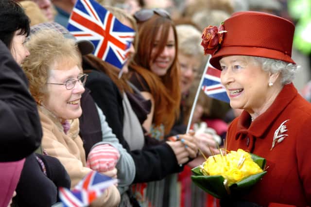 The Queen meets people on the walkabout outside the town hall on her visit to Banbury in 2008.