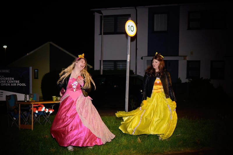 A pair of princesses enjoying the warm spring evening during the charity walk.