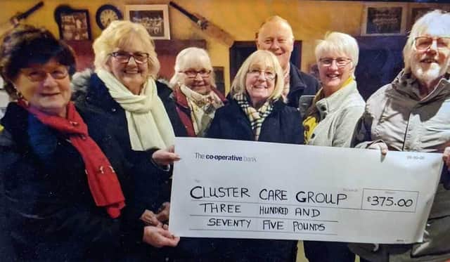 Chipping Warden and Edgecote WI hand over their cheque to Andrew Johnson of the Cluster Care group