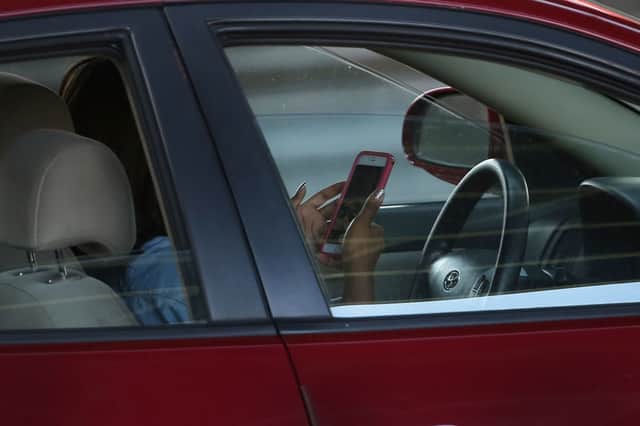 MPs want hands free phones to be banned while driving (Photo: Spencer Platt/Getty Images)