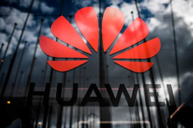 The logo of Chinese telecom giant Huawei is pictured during the Web Summit in Lisbon on November 6, 2019