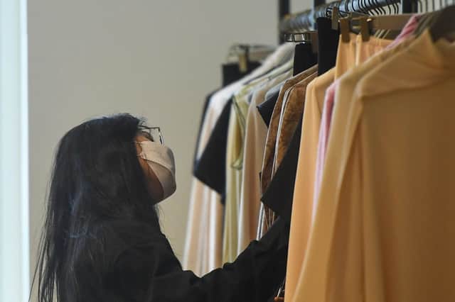 A woman wears a face mask while shopping in Selfridges (Photo: Peter Summers/Getty Images)