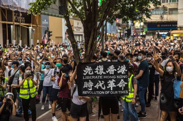 Protesters chant slogans during a rally against a new national security law in Hong Kong on 1 July 2020 (Photo: DALE DE LA REY/AFP via Getty Images)