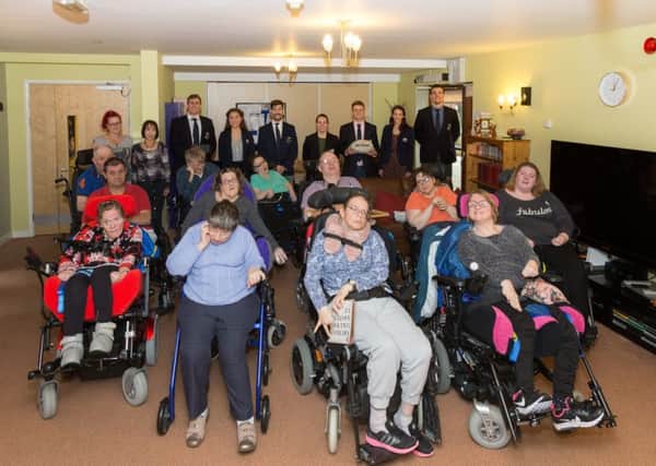 The residents of Agnes Court with the Oxford University rugby players. Photo: Keith Barnes/Leonard Cheshire Disability NNL-171127-100021001