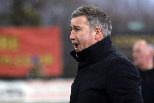 Banbury United manager Mike Ford urges his side on against Farnborough