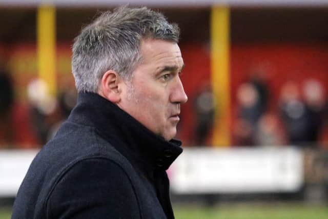 Banbury United manager Mike Ford was glad to get a point against Ketering Town