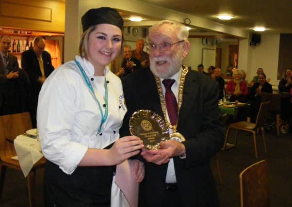 Rotary Club Young Chef winner Holli Thomas is presented with her trophy by the then Banbury town mayor, Gordon Ross NNL-170118-163827001