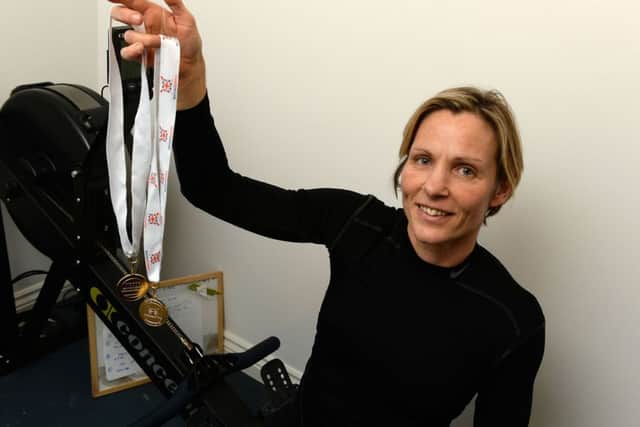 Sarah Gibbs with her two gold medals
