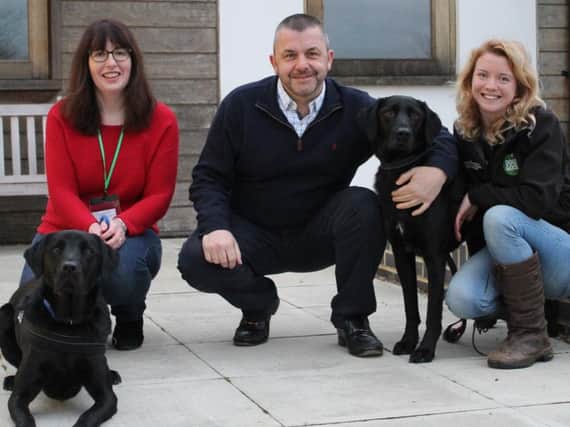 (Left to right) Alison Pearce and family dog Harvey, Andrew Keech from Oxfordshire Freemasons and Dogs for Good demo dog, Fidget and  Dogs for Good PAWS Family Dog Instructor, Robbie Campbell.