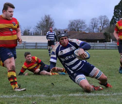 Jacob Mills slides over to score at Bicester for Banbury Bulls. Photo: Simon Grieve