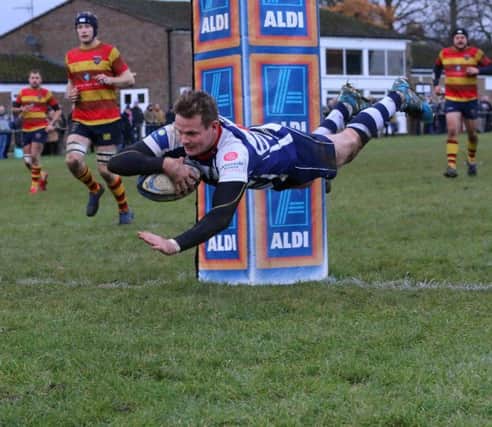 Tommy Gray looks good value as he flies over to score at Bicester for Banbury Bulls. Photo: Simon Grieve