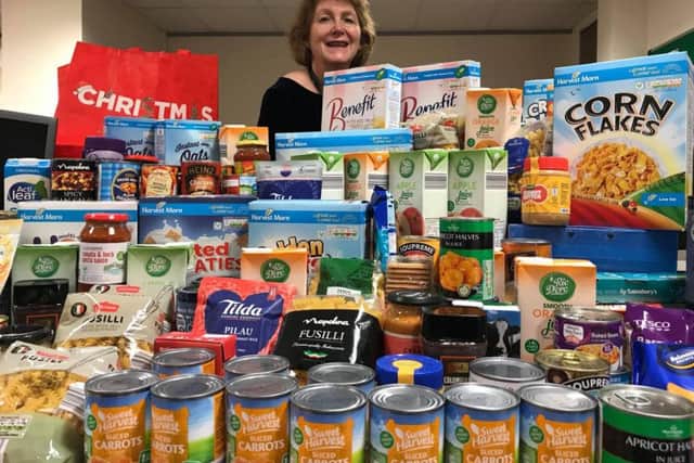 Sanctuary Housing neighbourhood partnerships manager Kate Winstanley with items donated for Banbury Foodbank. Photo: Sanctuary Group