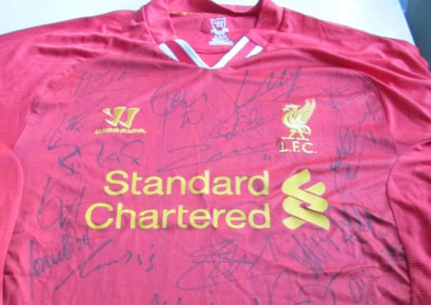 A Liverpool FC shirt sold by FA Premier Signings supposedly signed by the whole squad. Photo courtesy of Dorset County Council NNL-180115-152219001