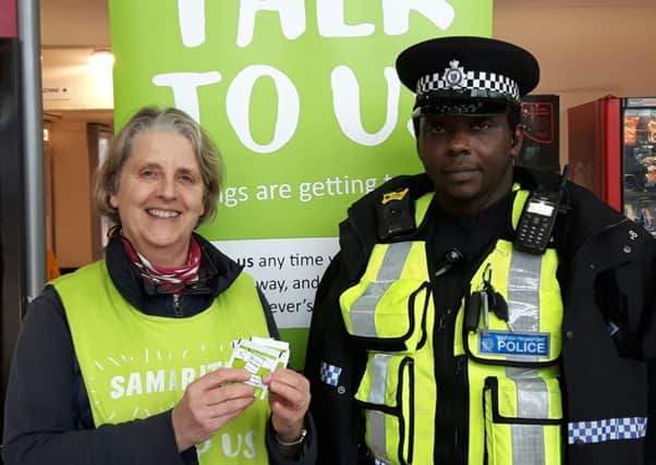 A British Transport Police officer joined Davina Birkbeck from Banbury Samaritans at the Brew Monday stand at Banbury railway station NNL-180116-162756001