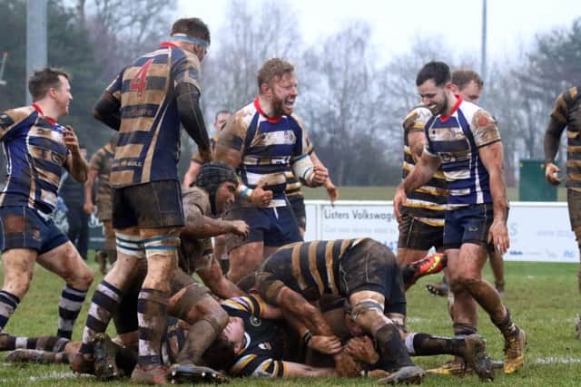 Jacob Mills is left under a under a pile of bodies after scoring for Banbury Bulls against Marlow
